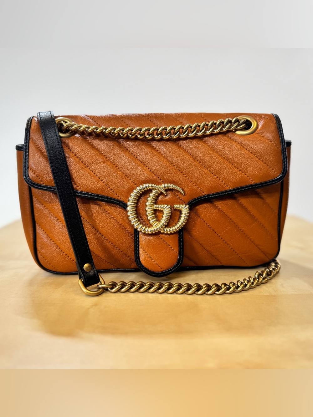 Gucci GG Marmont Matelasse Shoulder Bag in Cognac, Black Trim & Gold Hardware.